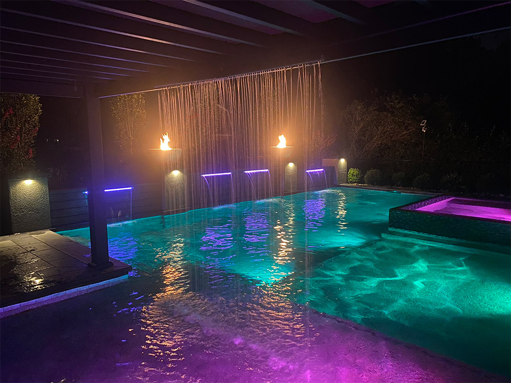 outdoor pool at night with lights
